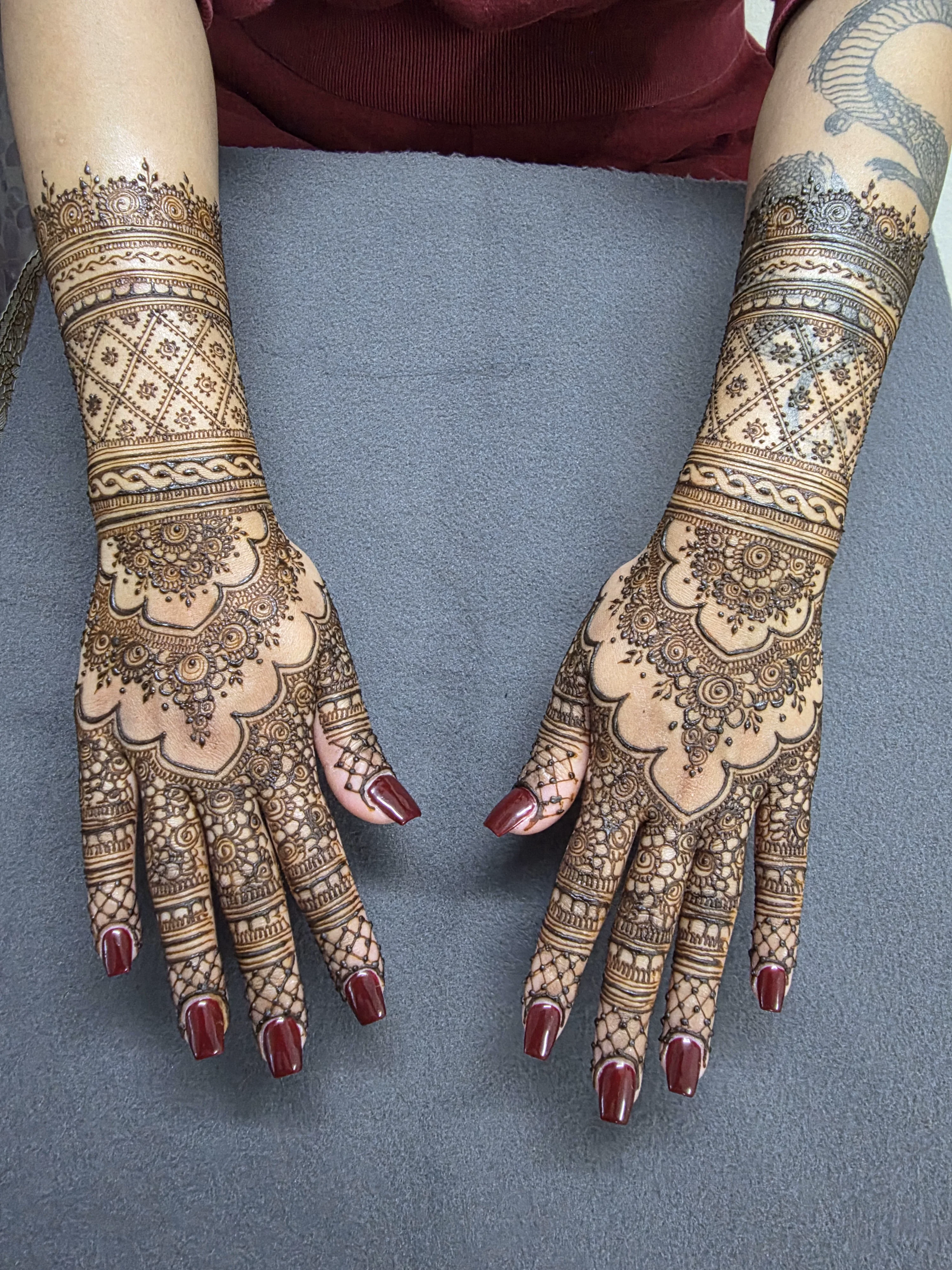 Henna artistry with fine mehndi pattern detail